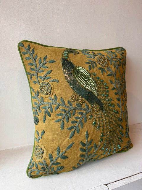 Sequinned cushion in green, peacock motify