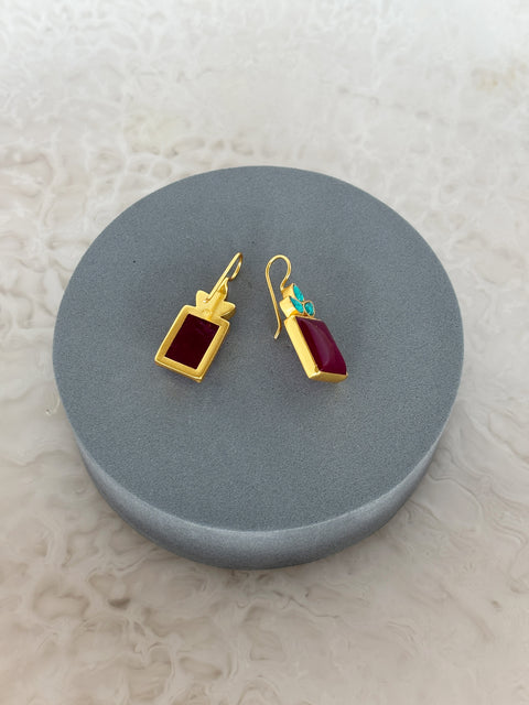 Angle Shot of Sterling Silver Gold Plated Meera Earrings Set With Red Quartz and Turquoise Gemstones