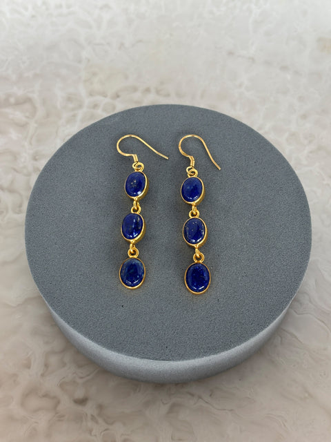 Front Facing Shot of Zara Gold Plated Sterling Silver with 3 Chain Linked Lapis Lazuli Earrings on Soft Pillow