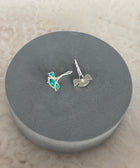 Rear View of Sterling Silver Gold Plated Nayantara Turquoise Gem Earrings on Grey Pillow
