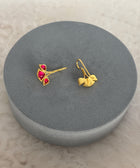 Rear View of Sterling Silver Gold Plated Nayantara Red Quartz Earrings on Grey Pillow