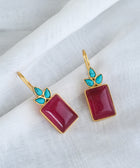 Front Shot of Sterling Silver Gold Plated Meera Earrings Set With Red Quartz and Turquoise Gemstones On A White Background