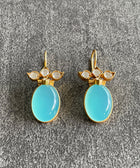 Silver Sterling Earring Gold Plated with Aqua Stone Handmade on Grey Textured Background