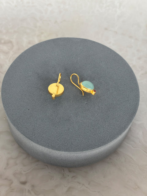 Rear Shot of Charvi Sterling Silver Gold Plated Aqua Chalcedony Earrings Handcrafted in Jaipur On a Grey Pillow