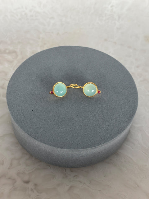 Side Shot of Charvi Sterling Silver Gold Plated Aqua Chalcedony Earrings Handcrafted in Jaipur On a Grey Pillow