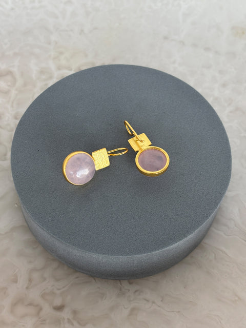 Angled Shot of Rose Quartz Dangle Kaira Earrings Made With Sterling Silver and Gold Plated