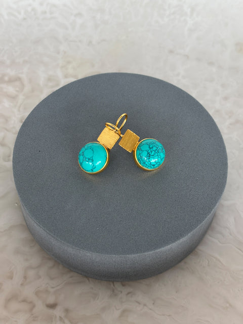 Front Facing Shot of Turquoise Gem Dangle Kaira Earrings Made With Sterling Silver and Gold Plated