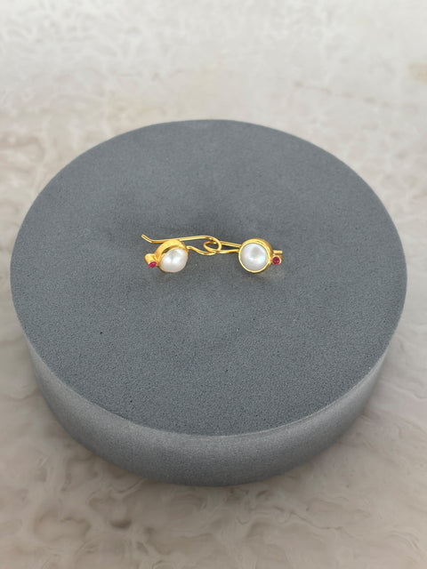 Side Shot of Charvi Sterling Silver Gold Plated Pearl Earrings Handcrafted in Jaipur On a Grey Pillow